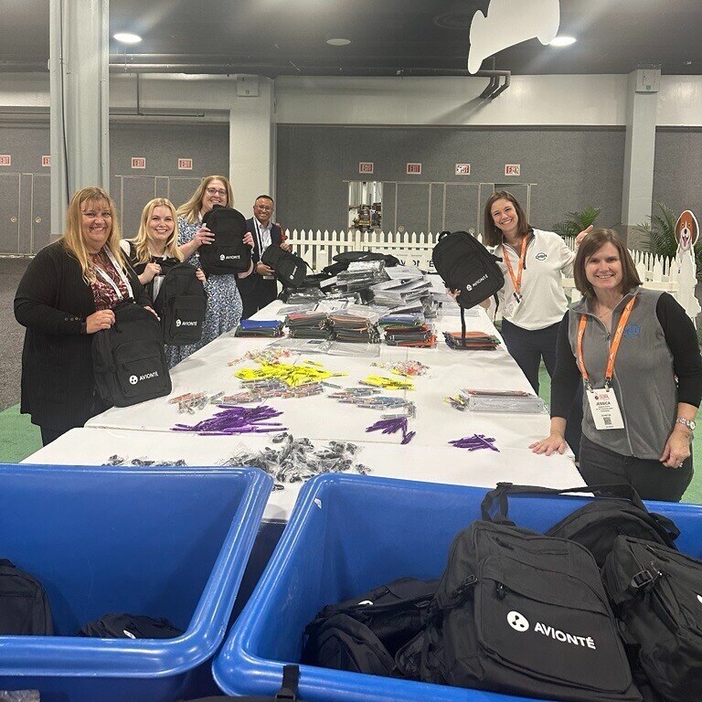 Q424 Staffing World backpack volunteers